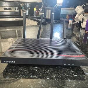 Netgear Black Wireless Router with Ribbed Design and LED Indicators